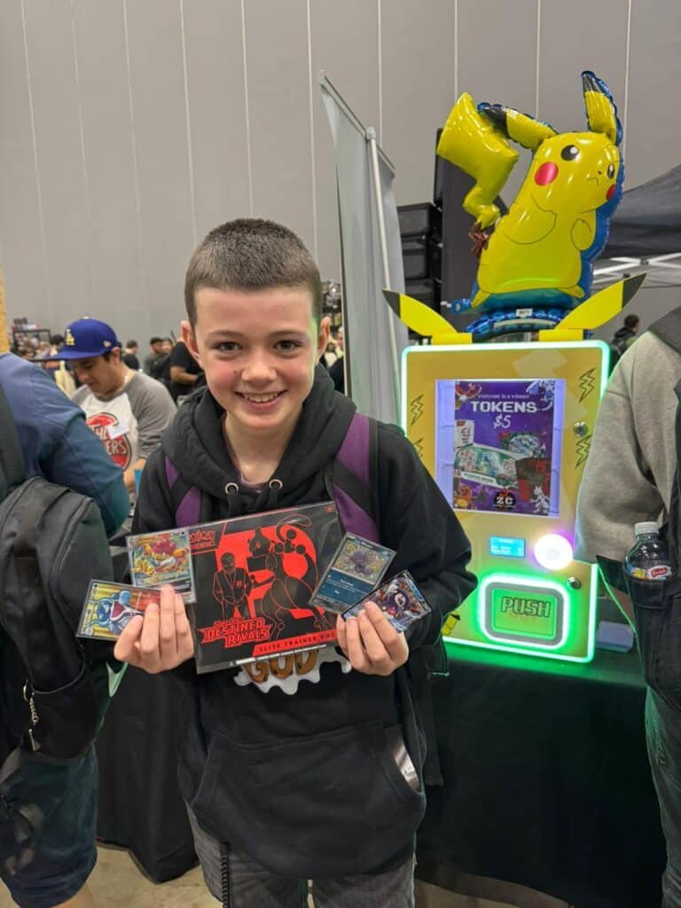 kid using pokemon card vending machine